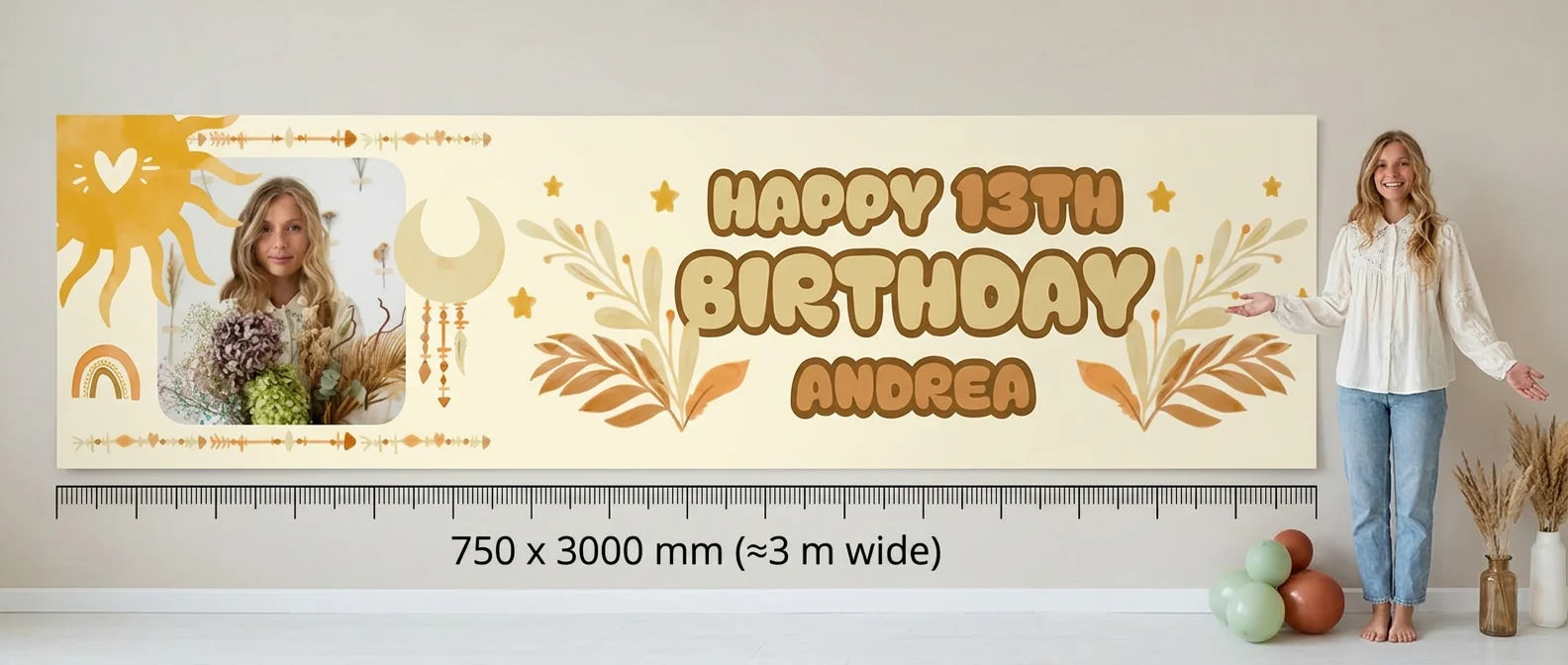 Person standing beside the boho theme birthday banner for scale, with 750 x 3000 mm size guide