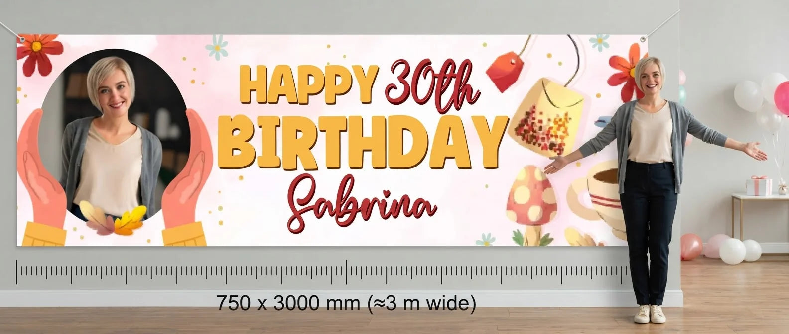 Person standing beside the Tea Party Birthday Banner for scale, with size guide showing 750 x 3000 mm