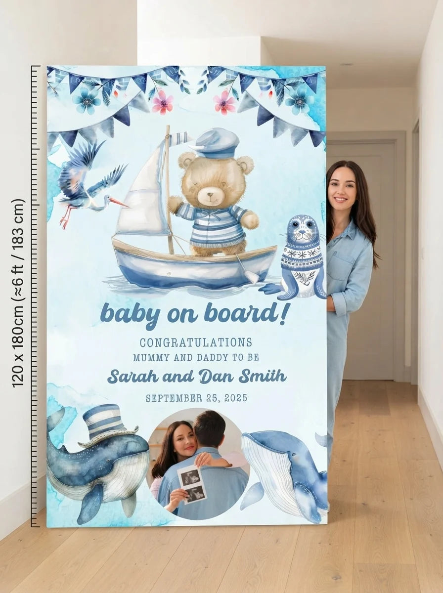Person standing beside the Baby On Board Baby Shower Party Mega Card for scale in a size guide
