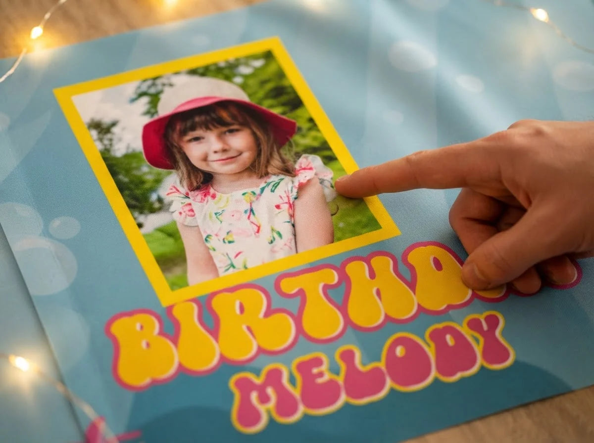 Close-up of the personalised name and photo printed on the Baby Shark Birthday Banner