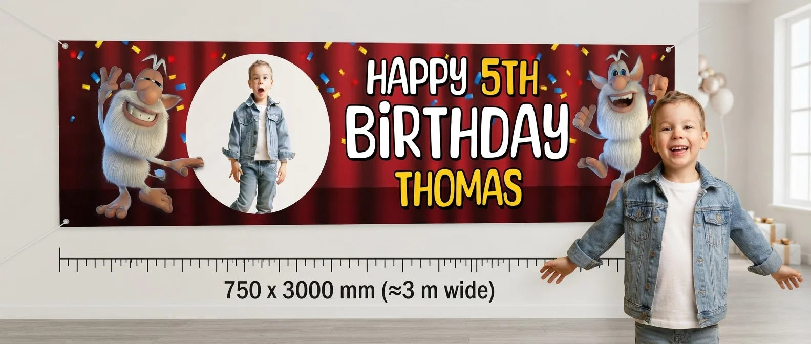 Person standing beside the Booba Birthday Banner for scale, with size guide showing 750 x 3000 mm