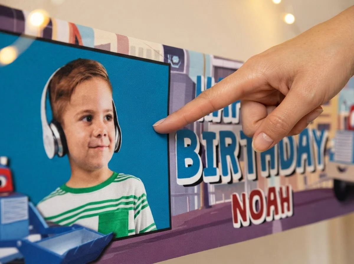 Close-up of the personalised name and photo printed on the Carl The Super Truck Birthday Banner