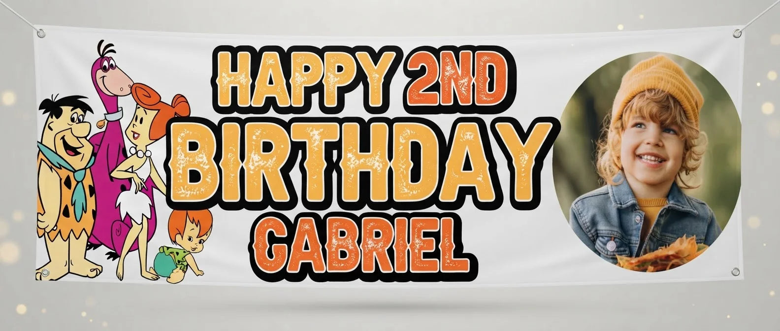 Personalised Flintstones Birthday Banner displayed against a plain studio background