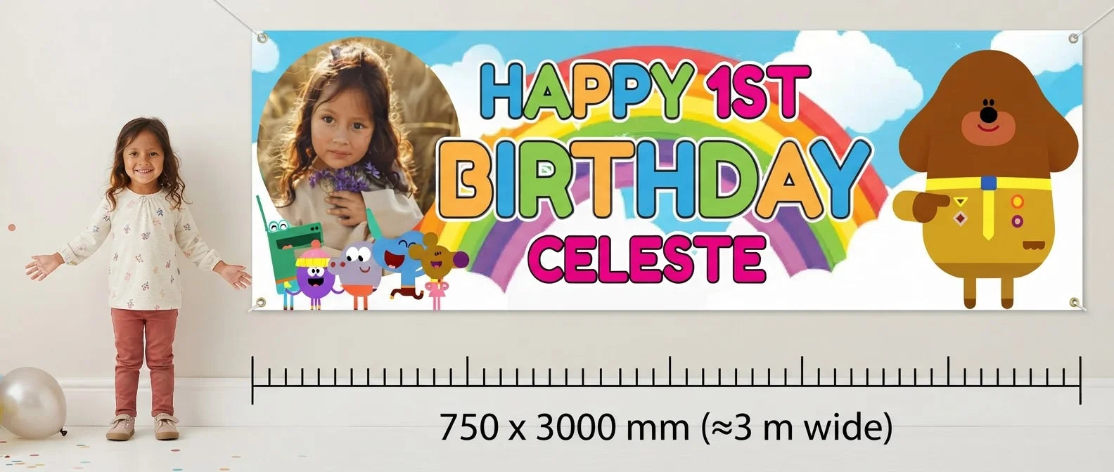 Person standing beside the Hey Duggee Birthday Banner for scale, with size guide showing 750 x 3000 mm