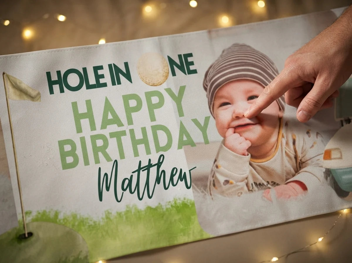 Close-up of the personalised name and photo printed on the Hole in One Birthday Party Banner