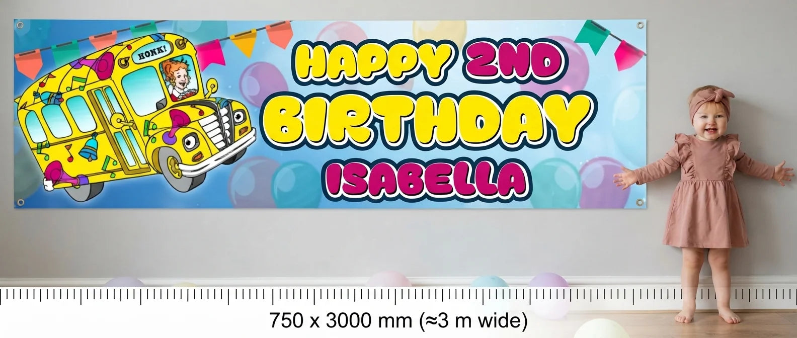 Person standing beside the Magic School Bus Birthday Banner for scale, with size guide showing 750 x 3000 mm
