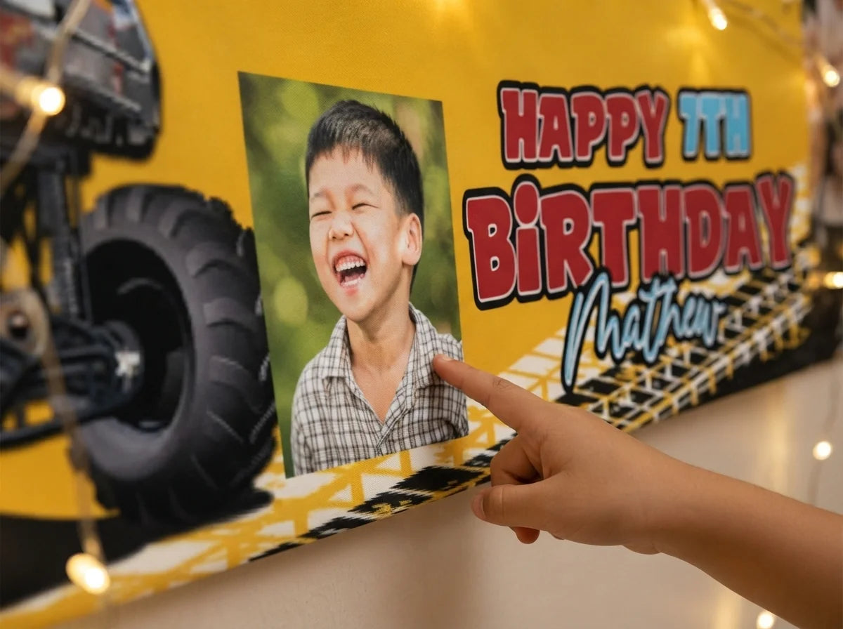 Close-up of the personalised name and photo printed on the Monster Truck Birthday Banner