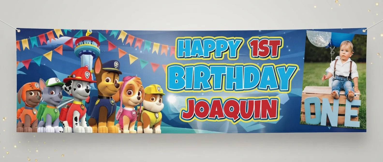 Personalised Paw Patrol Birthday Banner displayed against a plain studio background