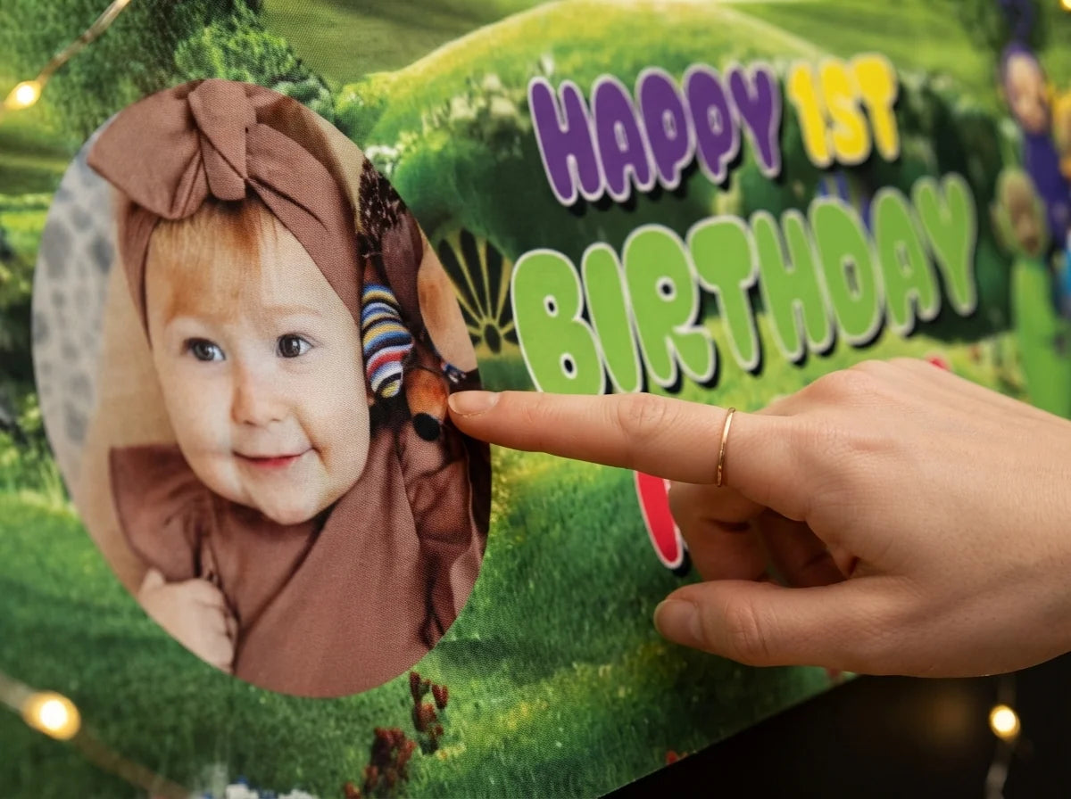 Close-up of the personalised name and photo printed on the Teletubbies Birthday Banner