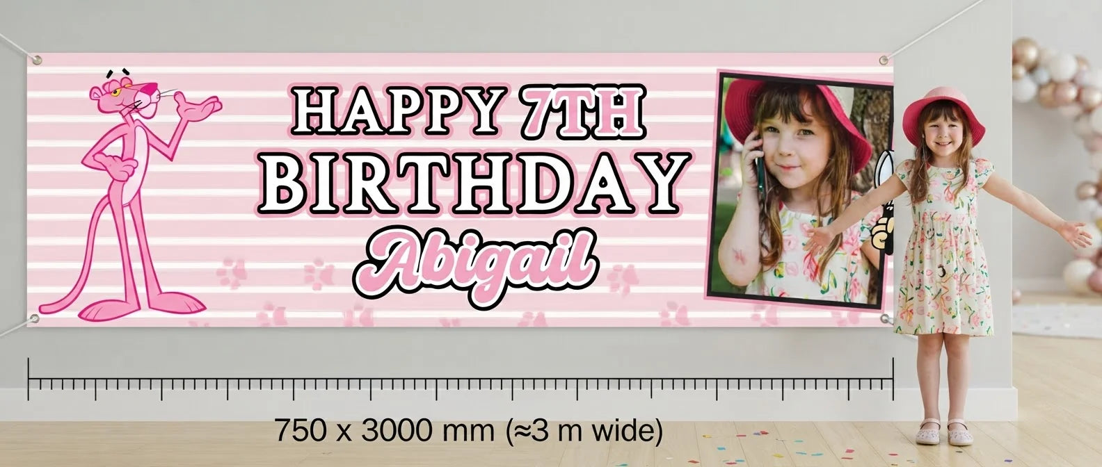 Person standing beside the The Pink Panther Birthday Banner for scale, with size guide showing 750 x 3000 mm