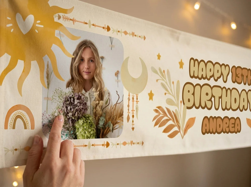 Close-up of the personalised photo, name and age printed on the boho theme birthday banner
