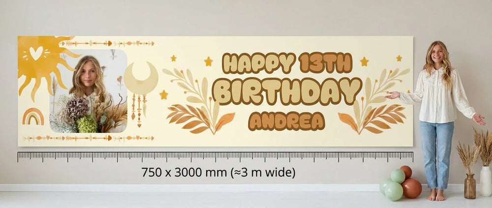 Person standing beside the boho theme birthday banner for scale, with 750 x 3000 mm size guide