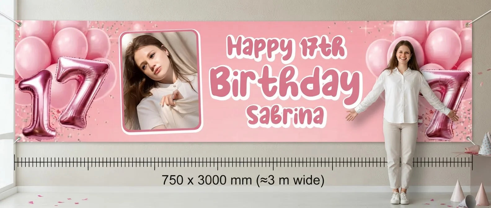 Person standing beside the Pink 3D Balloon Birthday Party Banner for scale, with size guide showing 750 x 3000 mm