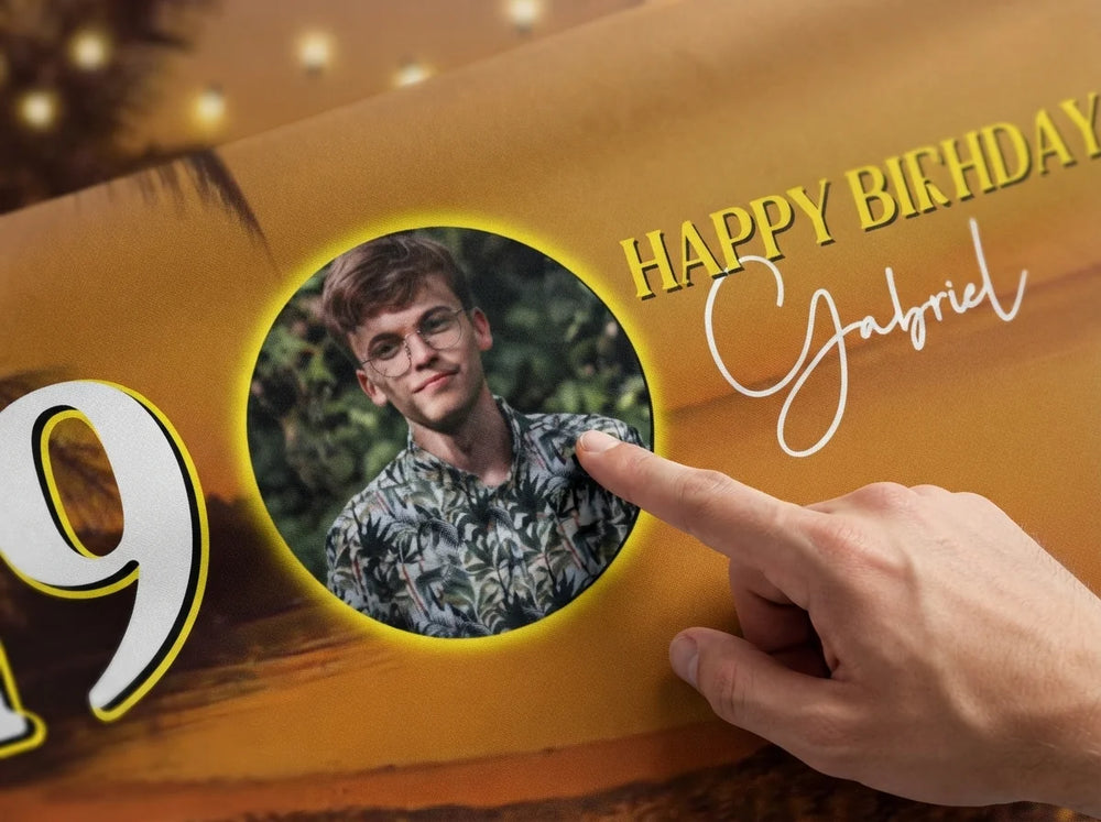 Close-up of the personalised name and photo printed on the Beach Sunset Birthday Party Banner