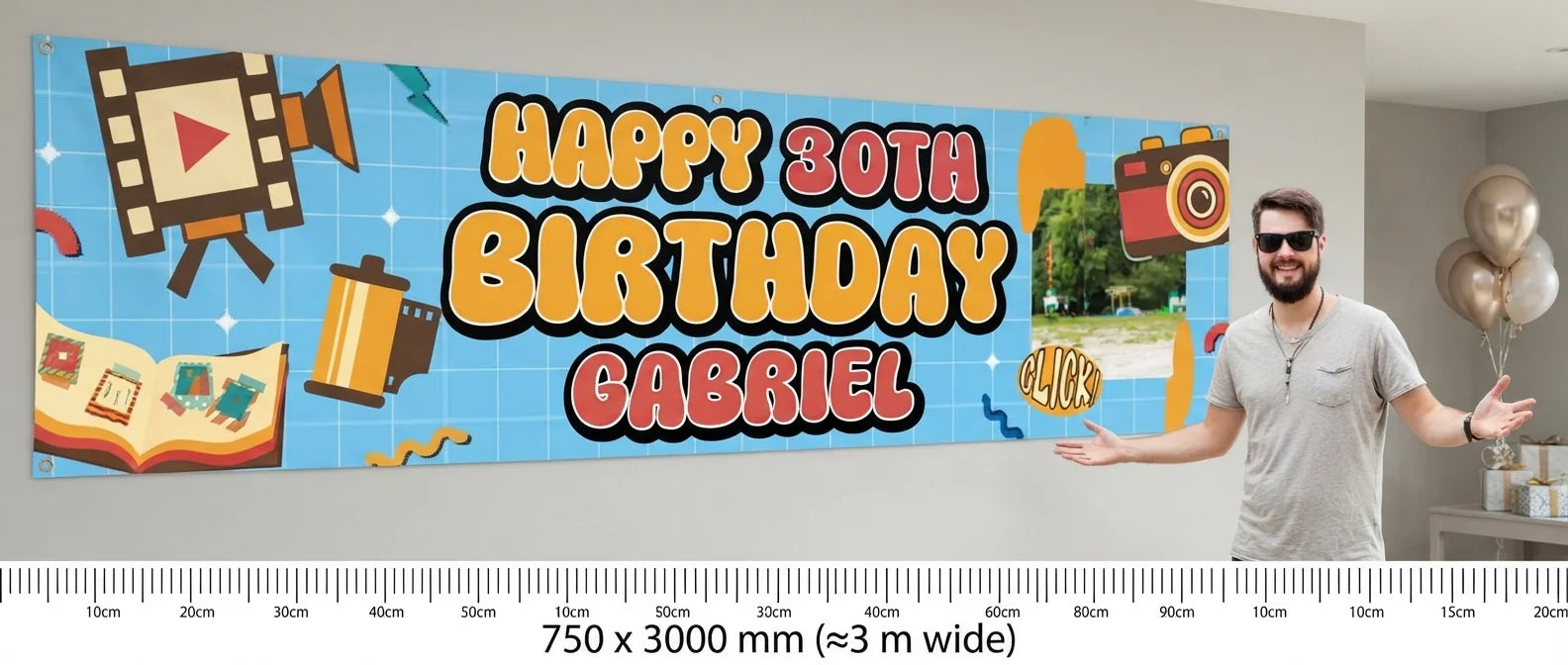 Person standing beside the Vintage Camera Birthday Party Banner for scale, with size guide showing 750 x 3000 mm