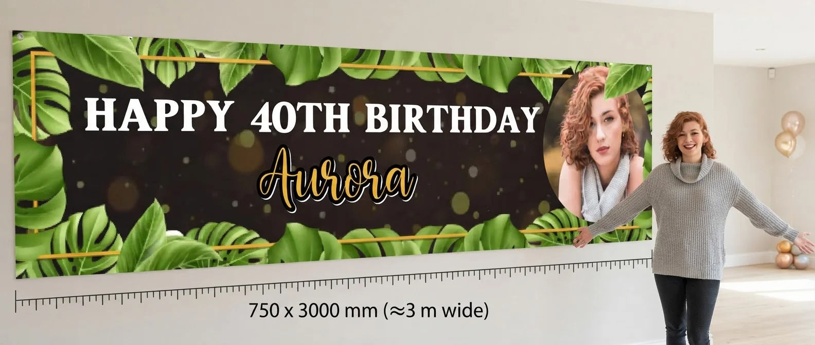 Person standing beside the Black Tropical Birthday Party Banner for scale, with size guide showing 750 x 3000 mm