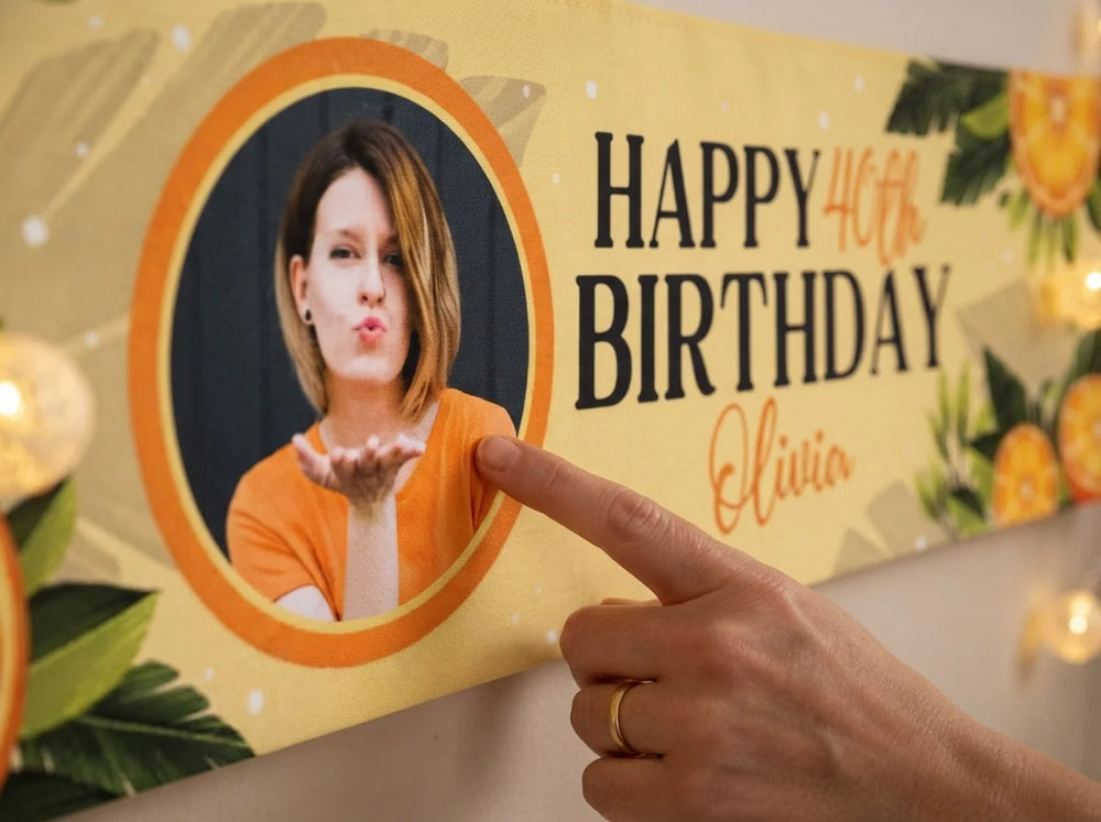Close-up of the personalised name and photo printed on the Orange Citrus Birthday Party Banner