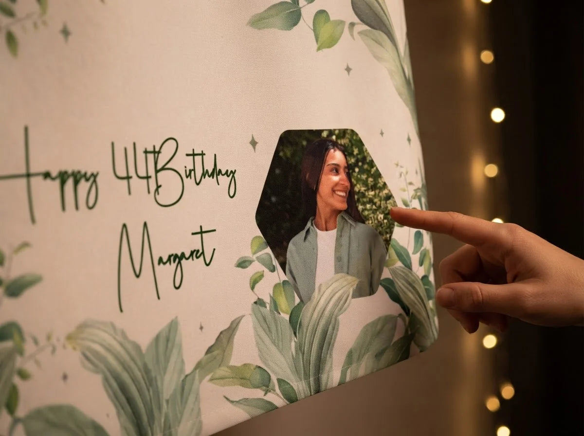 Close-up of the personalised name and photo printed on the Botanical Theme Birthday Party Banner