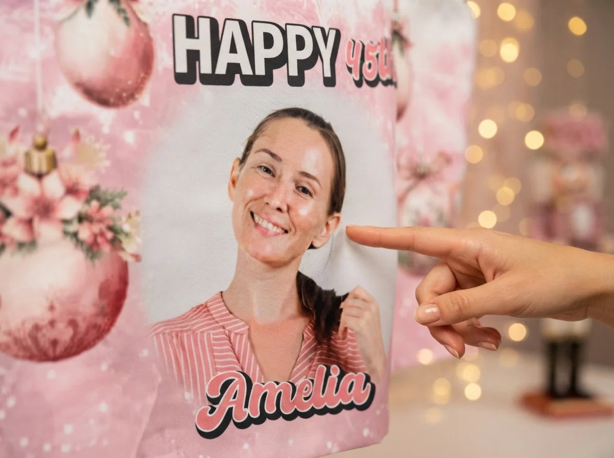 Close-up of the personalised name and photo printed on the Pink Christmas Birthday Party Banner
