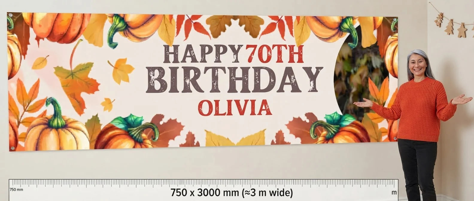 Person standing beside the Pumpkin Theme Birthday Party Banner for scale, with size guide showing 750 x 3000 mm