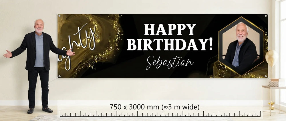 Person standing beside the Black & Gold Birthday Party Banner for scale, with size guide showing 750 x 3000 mm
