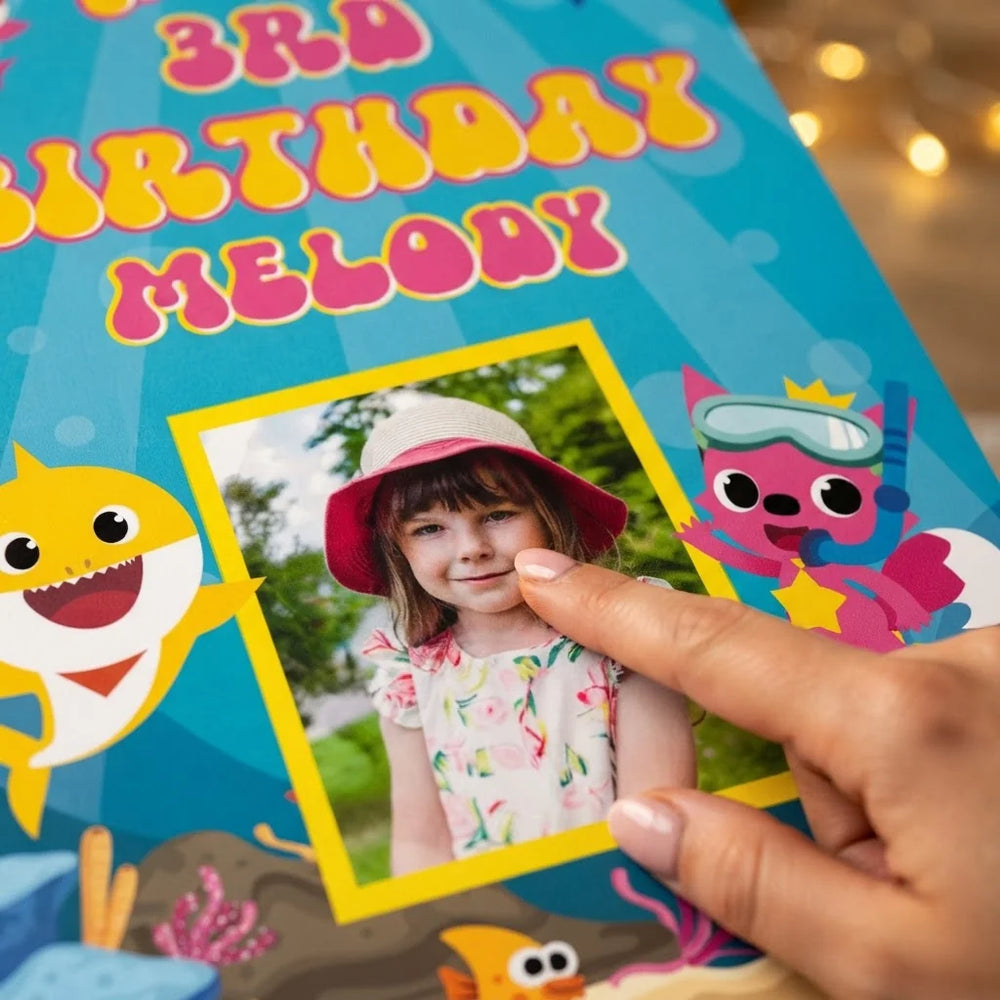 Close-up of the personalised name and photo printed on the Baby Shark Mega Card