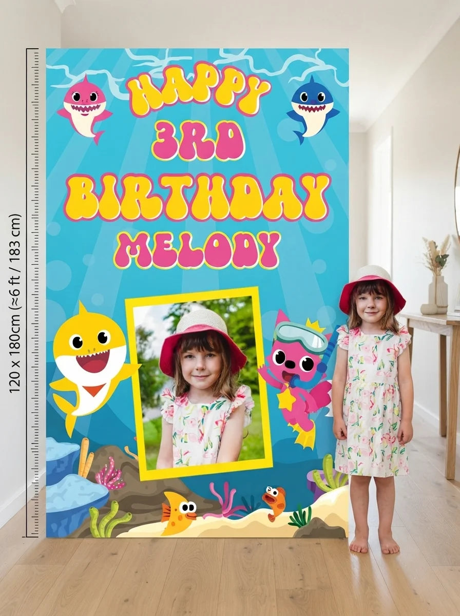 Person standing beside the Baby Shark Mega Card for scale in a size guide