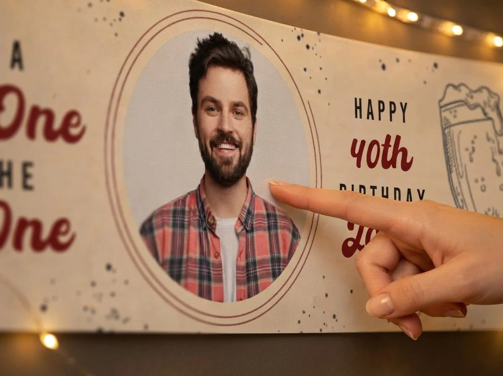 Close-up of the personalised name and photo printed on the Cold One For The Old One Birthday Party Banner
