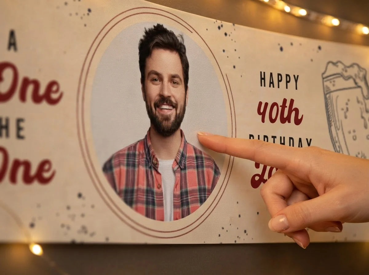 Close-up of the personalised name and photo printed on the Cold One For The Old One Birthday Party Banner