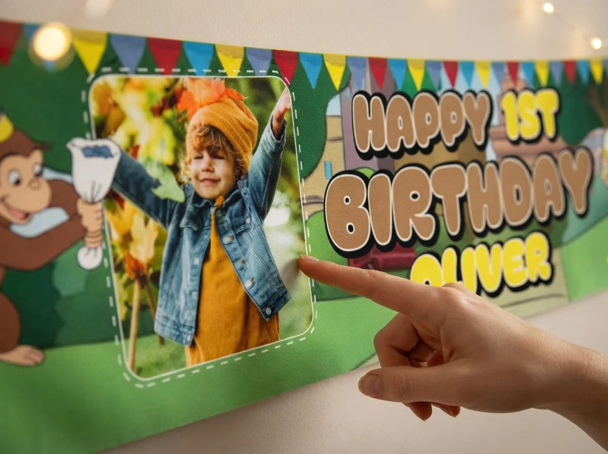 Close-up of the personalised name and photo printed on the Curious George Birthday Banner