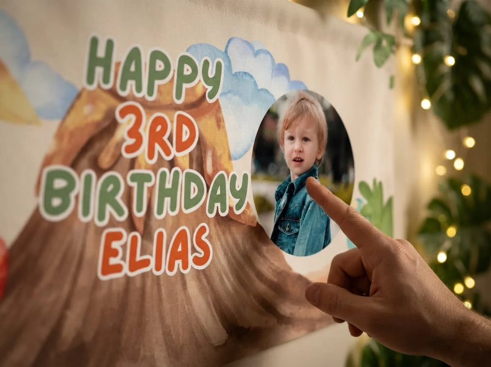 Close-up of the personalised name and photo printed on the Dino Island Birthday Party Banner