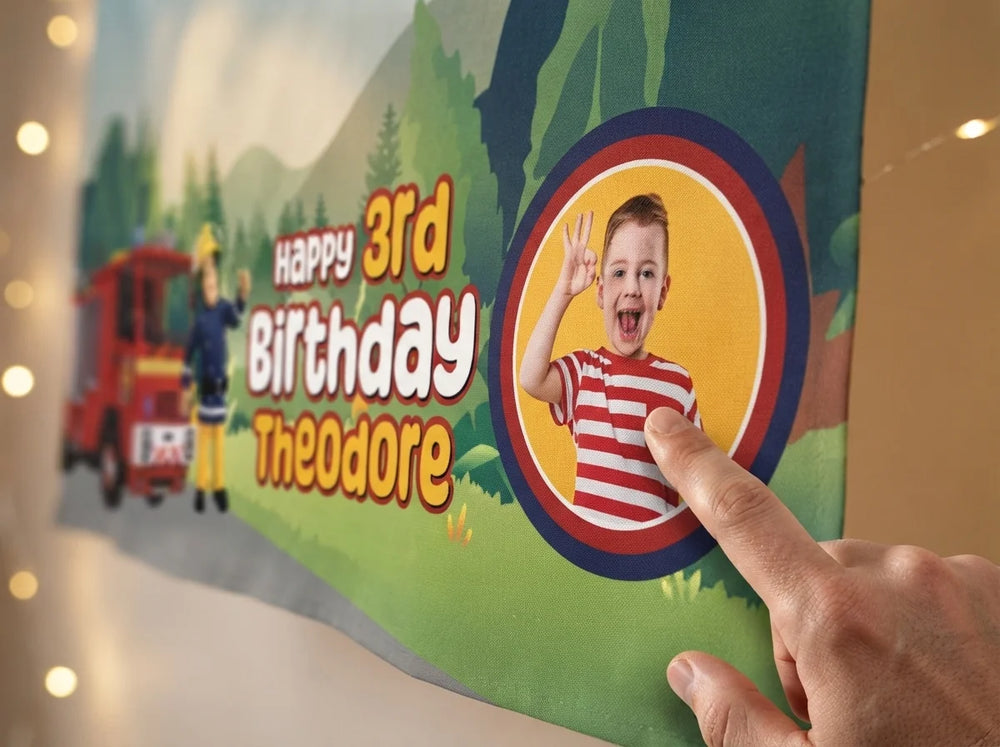 Close-up of the personalised name and photo printed on the Fireman Sam Birthday Banner
