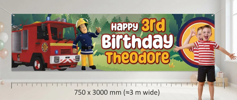 Person standing beside the Fireman Sam Birthday Banner for scale, with size guide showing 750 x 3000 mm