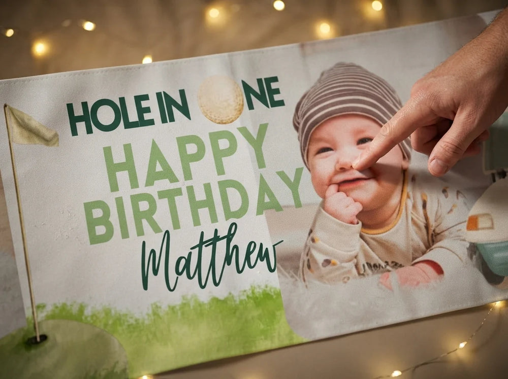 Close-up of the personalised name and photo printed on the Hole in One Birthday Party Banner