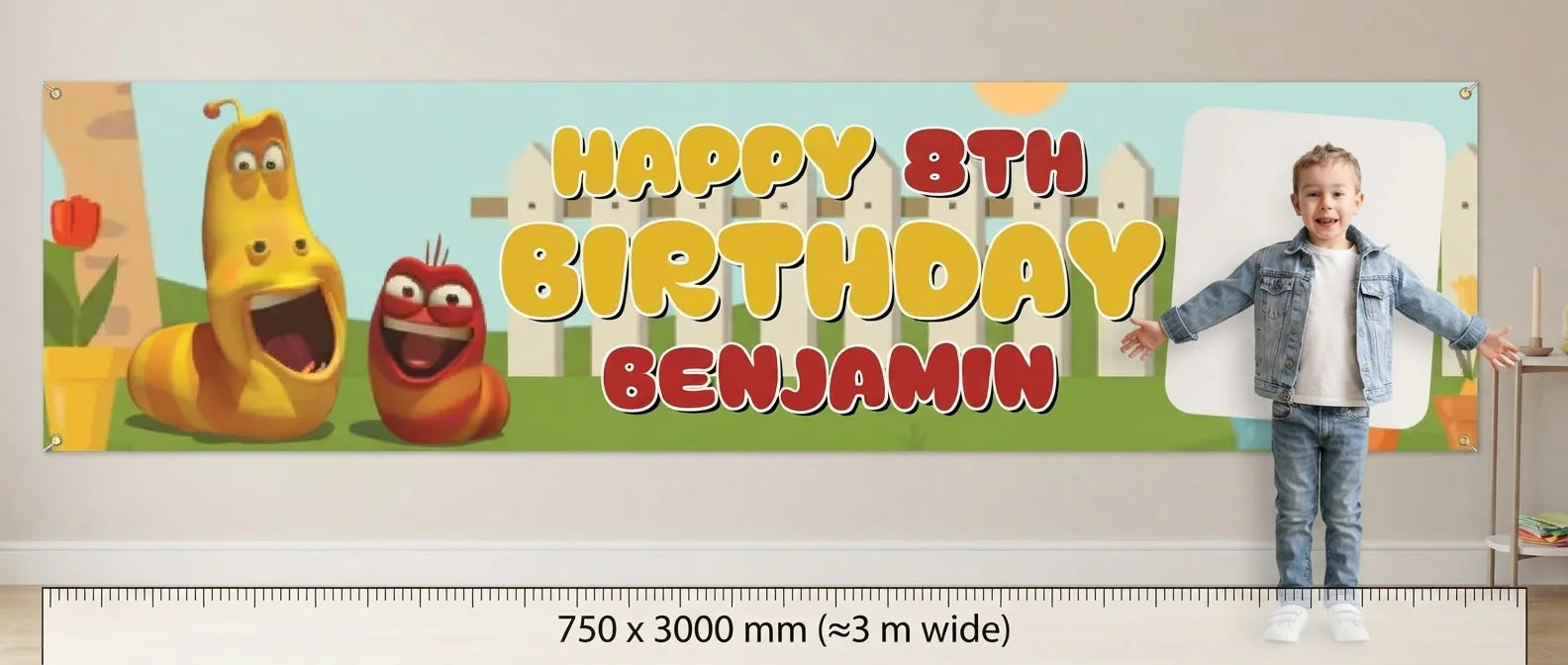 Person standing beside the Larva Birthday Banner for scale, with size guide showing 750 x 3000 mm
