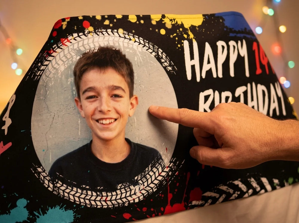 Close-up of the personalised name and photo printed on the Lock, Load & Splat Birthday Party Banner