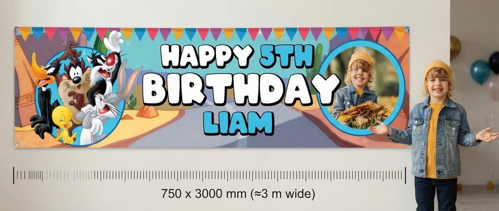 Person standing beside the Looney Tunes Birthday Banner for scale, with size guide showing 750 x 3000 mm