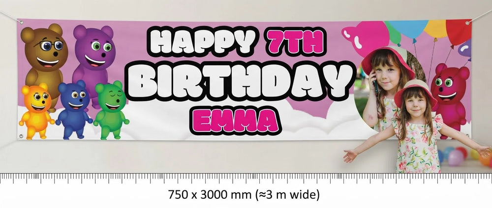 Person standing beside the Mega Gummy Bear Birthday Banner for scale, with size guide showing 750 x 3000 mm