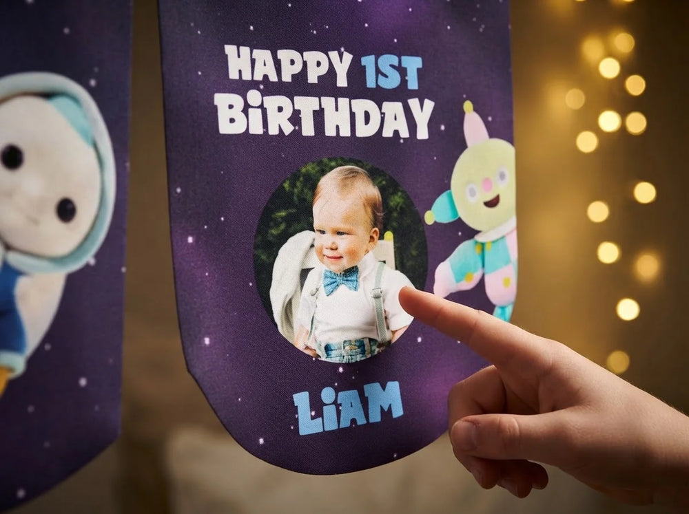 Close-up of the personalised name and photo printed on the Moon Baby Birthday Banner