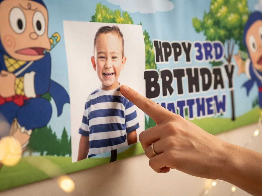Close-up of the personalised name and photo printed on the Ninja Hattori Birthday Banner