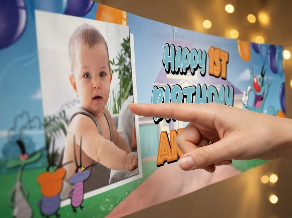 Close-up of the personalised name and photo printed on the Oggy Birthday Banner