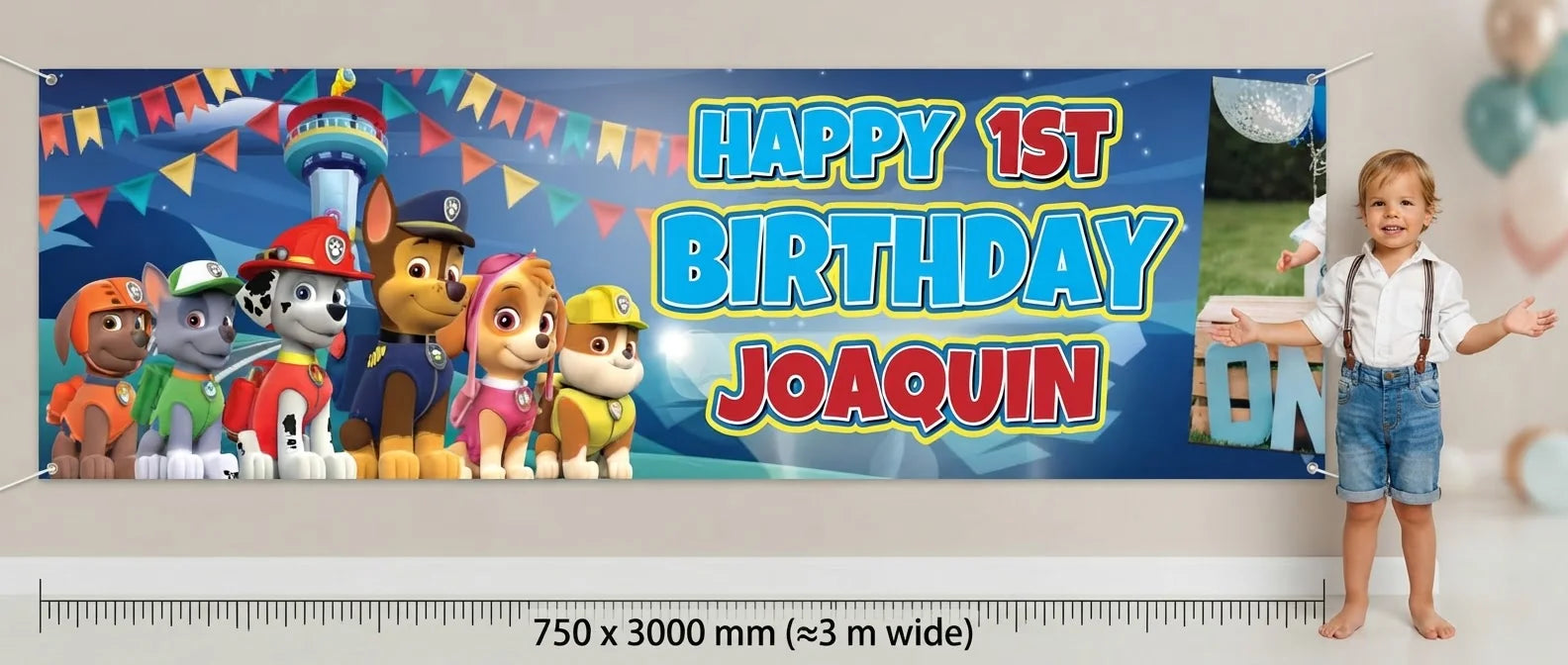 Person standing beside the Paw Patrol Birthday Banner for scale, with size guide showing 750 x 3000 mm