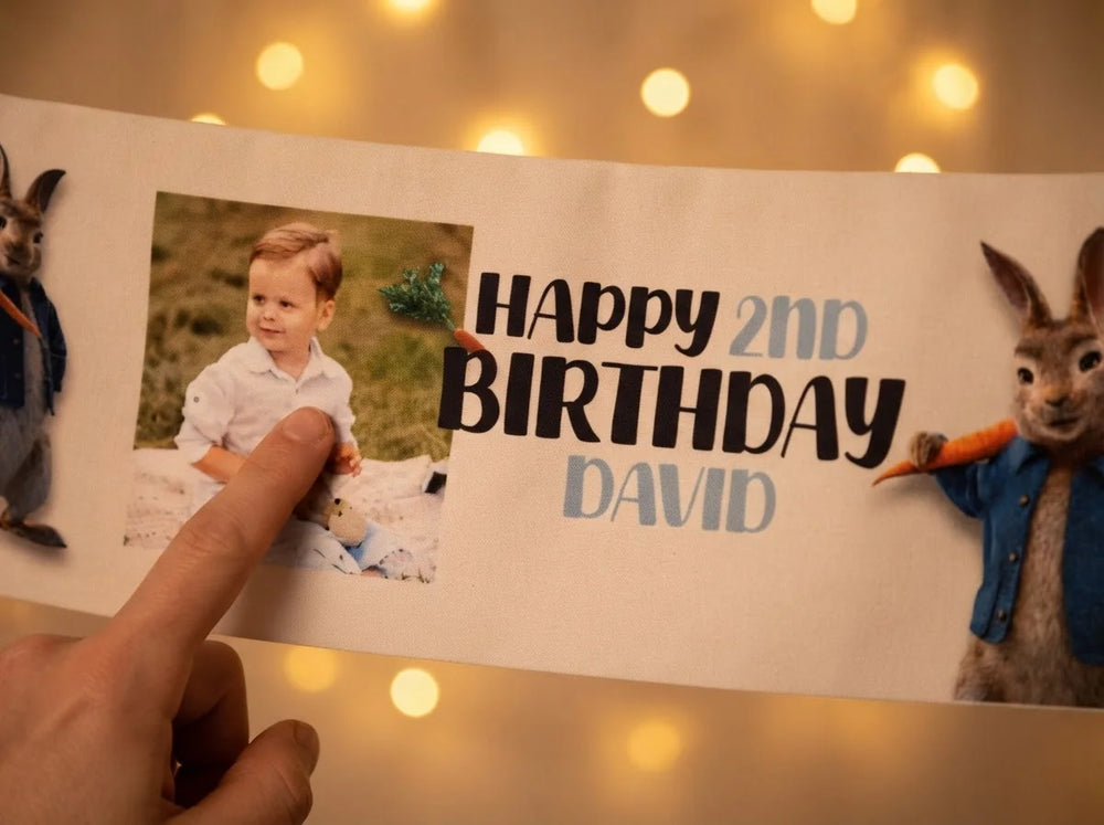 Close-up of the personalised name and photo printed on the Peter Rabbit Birthday Banner