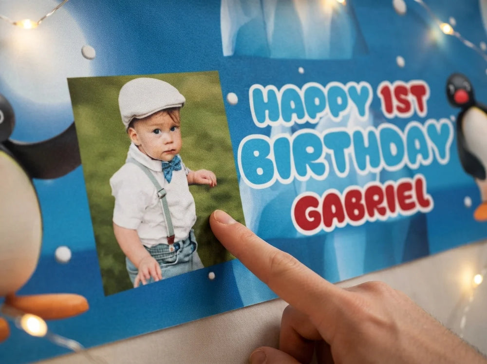 Close-up of the personalised name and photo printed on the Pingu Birthday Banner