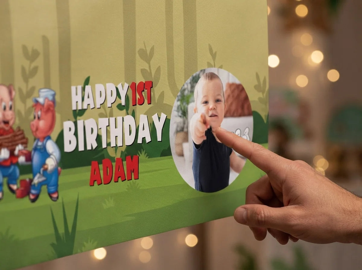 Close-up of the personalised name and photo printed on the Three Little Pigs Birthday Banner
