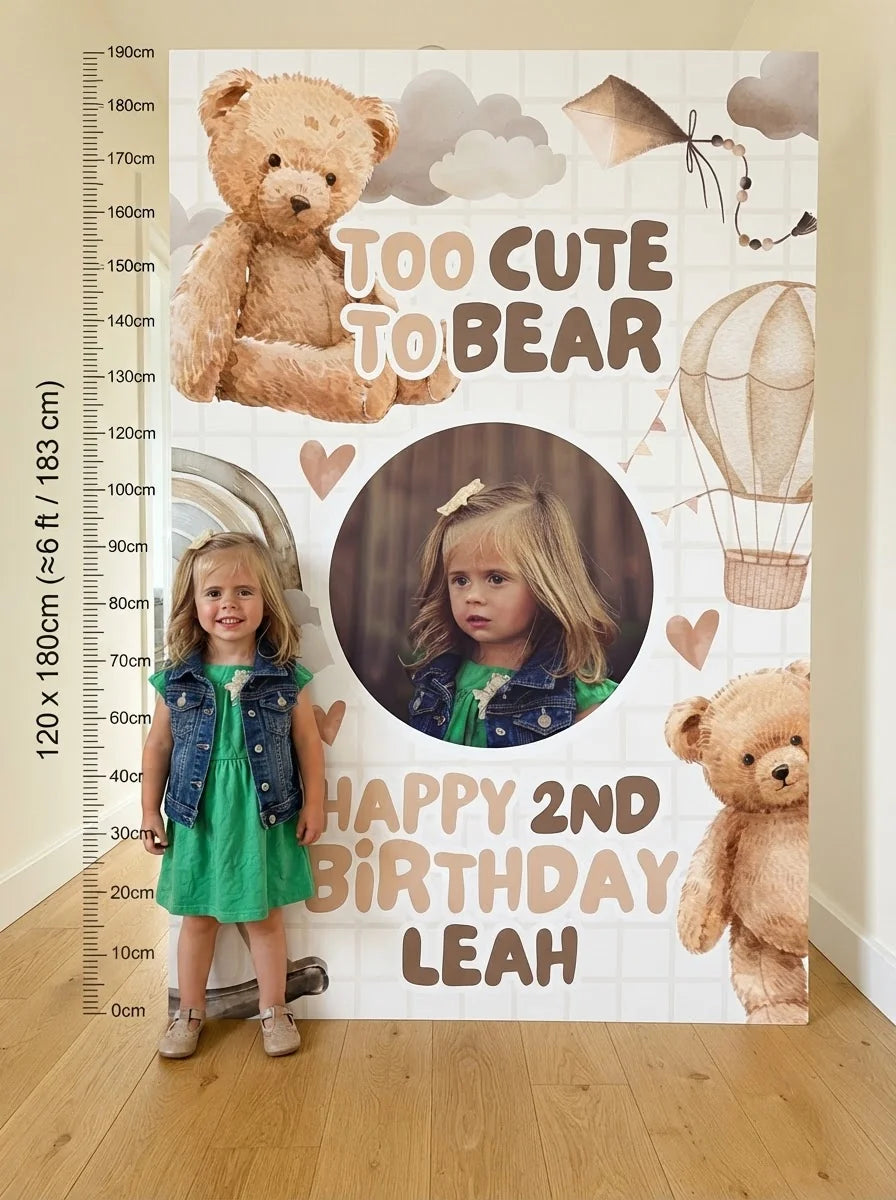 Person standing beside the Too Cute To Bear Birthday Party Mega Card for scale in a size guide