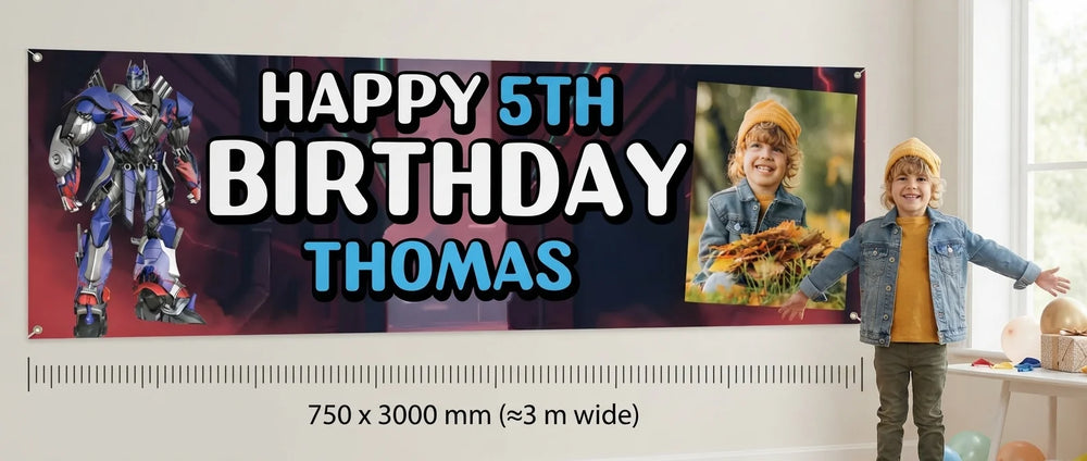 Person standing beside the Transformers Birthday Banner for scale, with size guide showing 750 x 3000 mm