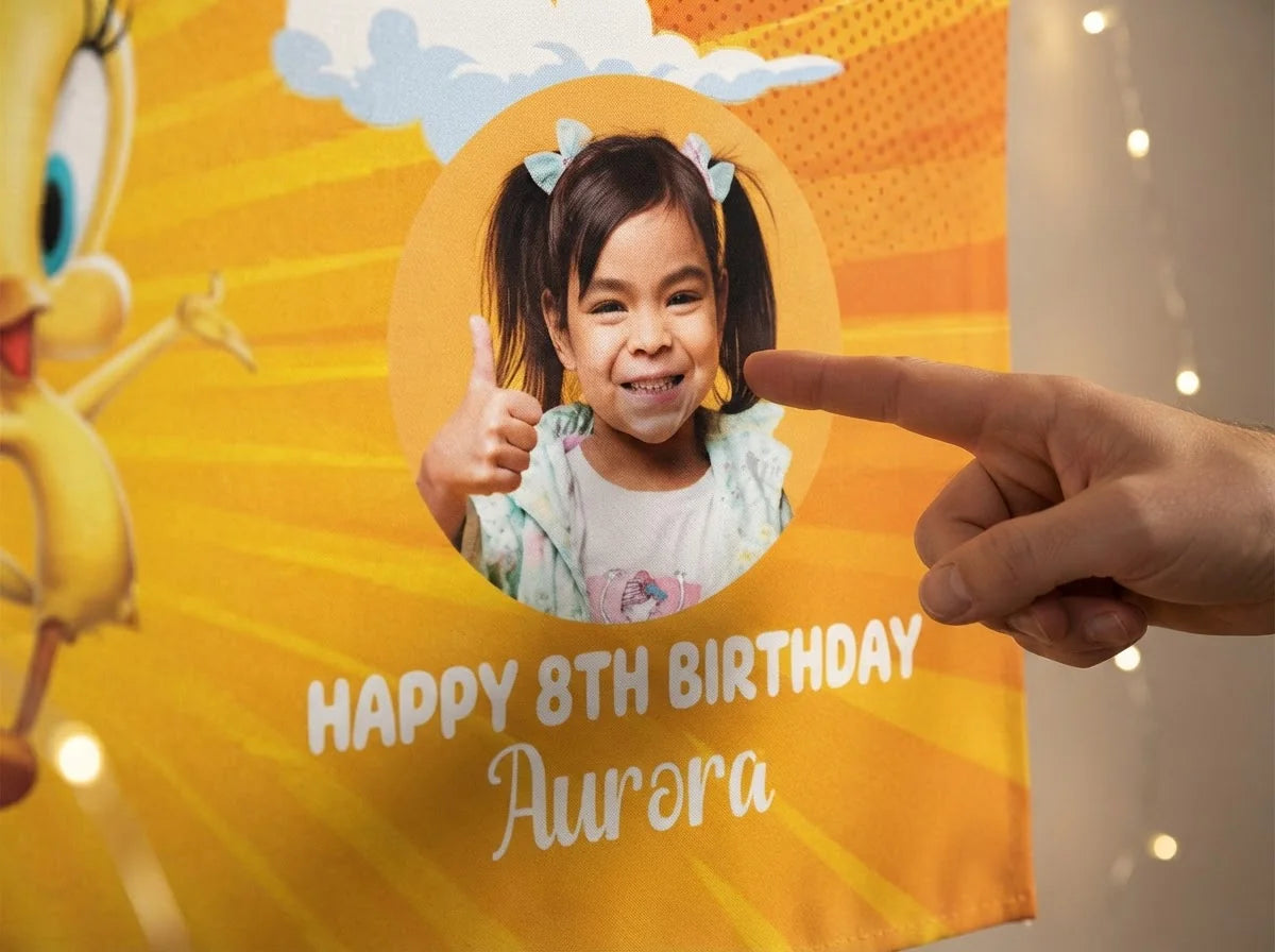 Close-up of the personalised name and photo printed on the Tweety Bird Birthday Banner